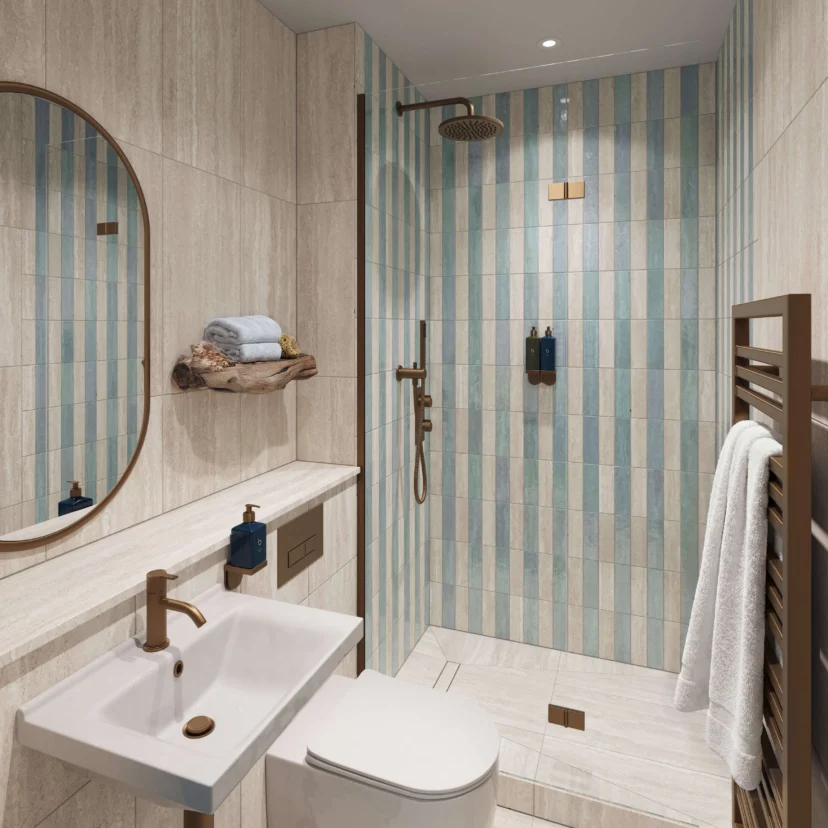 Family-friendly hotel bathroom with walk-in shower, striped blue tiles, towels and toiletries