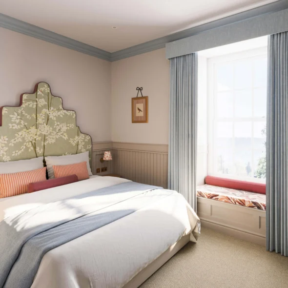 Serene hotel room with plush bed, elegant headboard, soft lighting, and inviting window seat.